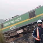 Fatehpur train accident: Overturned engine in bushes after collision.